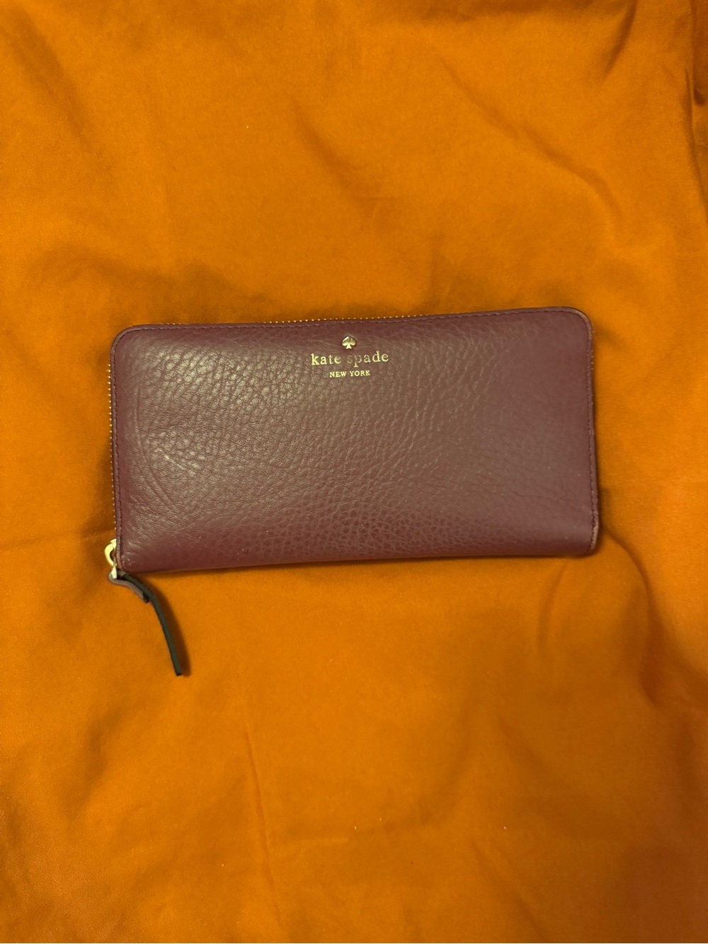 kate spade burgundy leather zip-around wallet